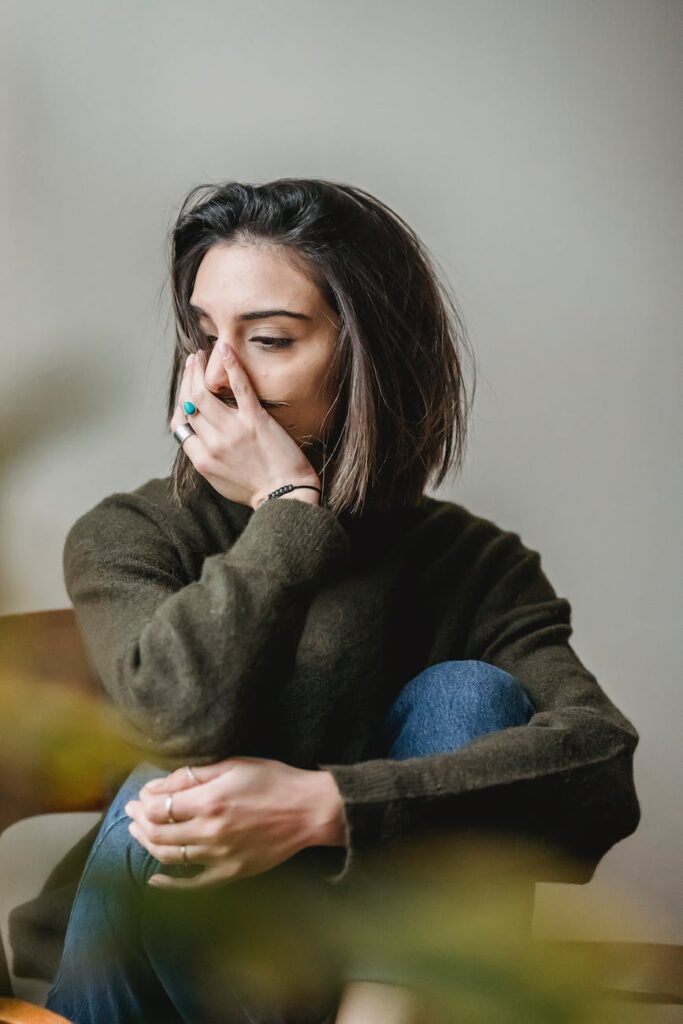 NET Stress reduction depressed woman sitting in room