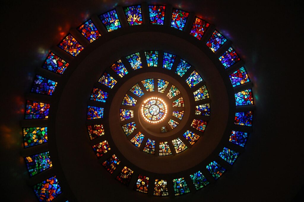 mediation worms eye view of spiral stained glass decors through the roof