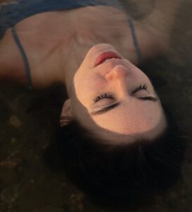 hydrotherapy a woman in blue tank top lying on water