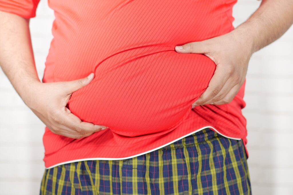 constipation and Bowel Difficulties close up photo of person holding his belly